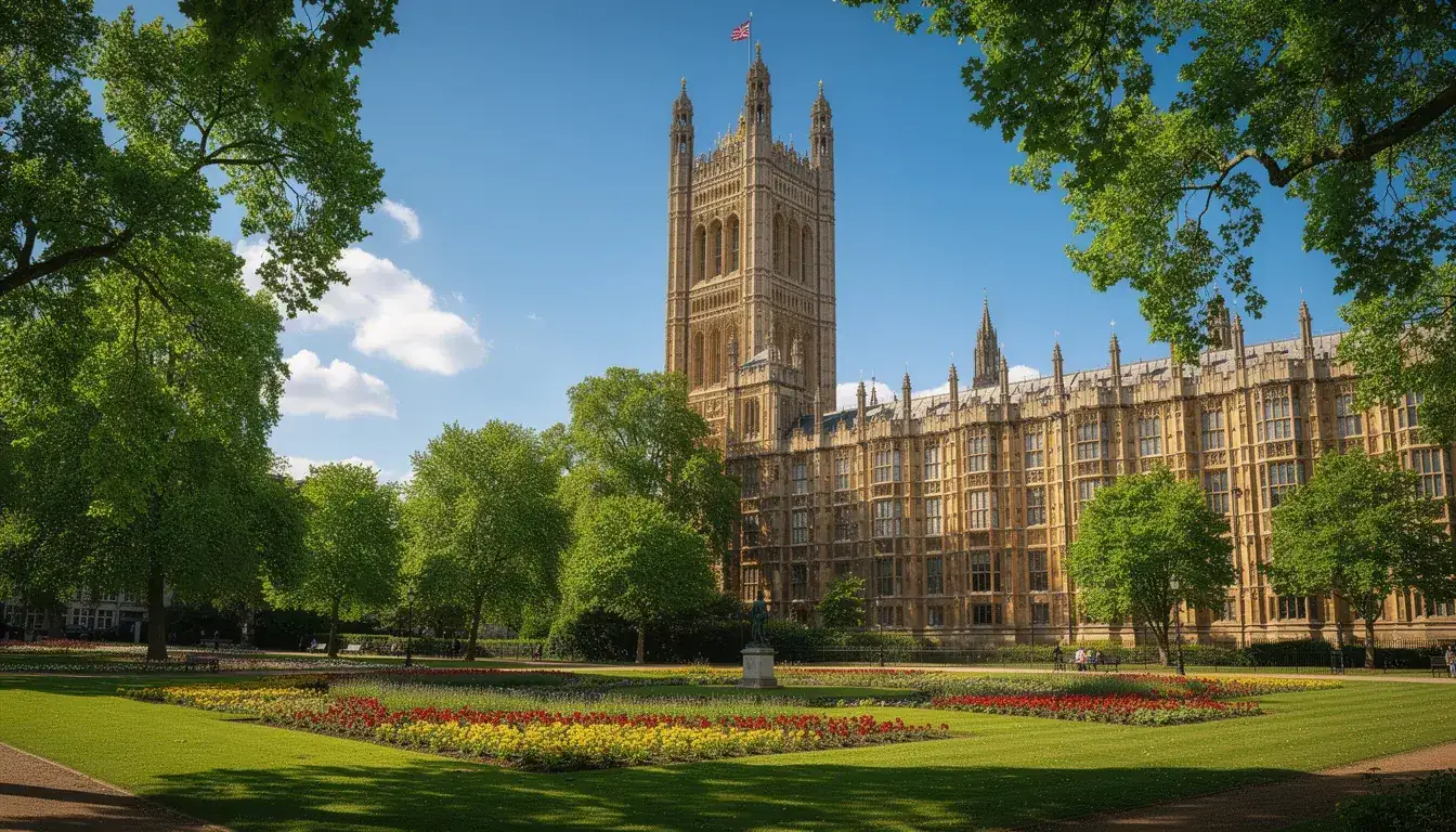 The Houses of Parliament and Victoria Tower seen from Victoria Tower Gardens on a bright summer day