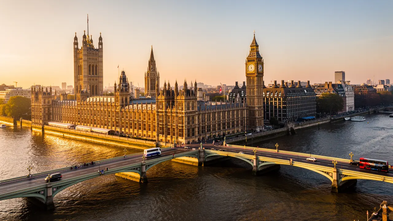 Houses of Parliament and Westminster Bridge at golden hour, representing leasehold reform legislation